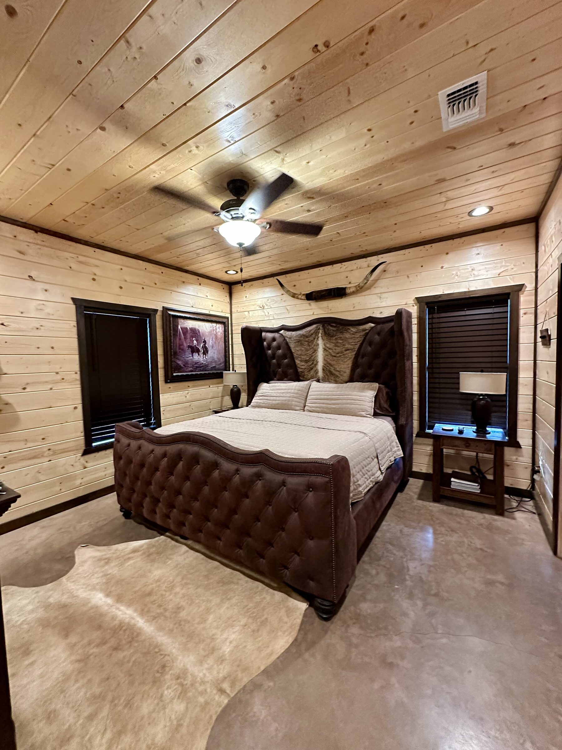 Master bedroom with tufted leather bed