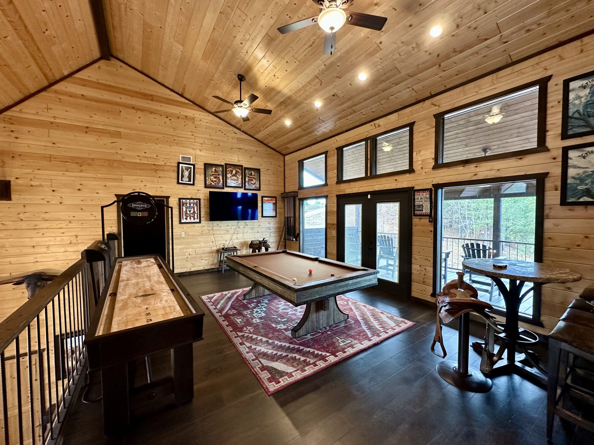 Game-room loft with pool table and shuffleboard
