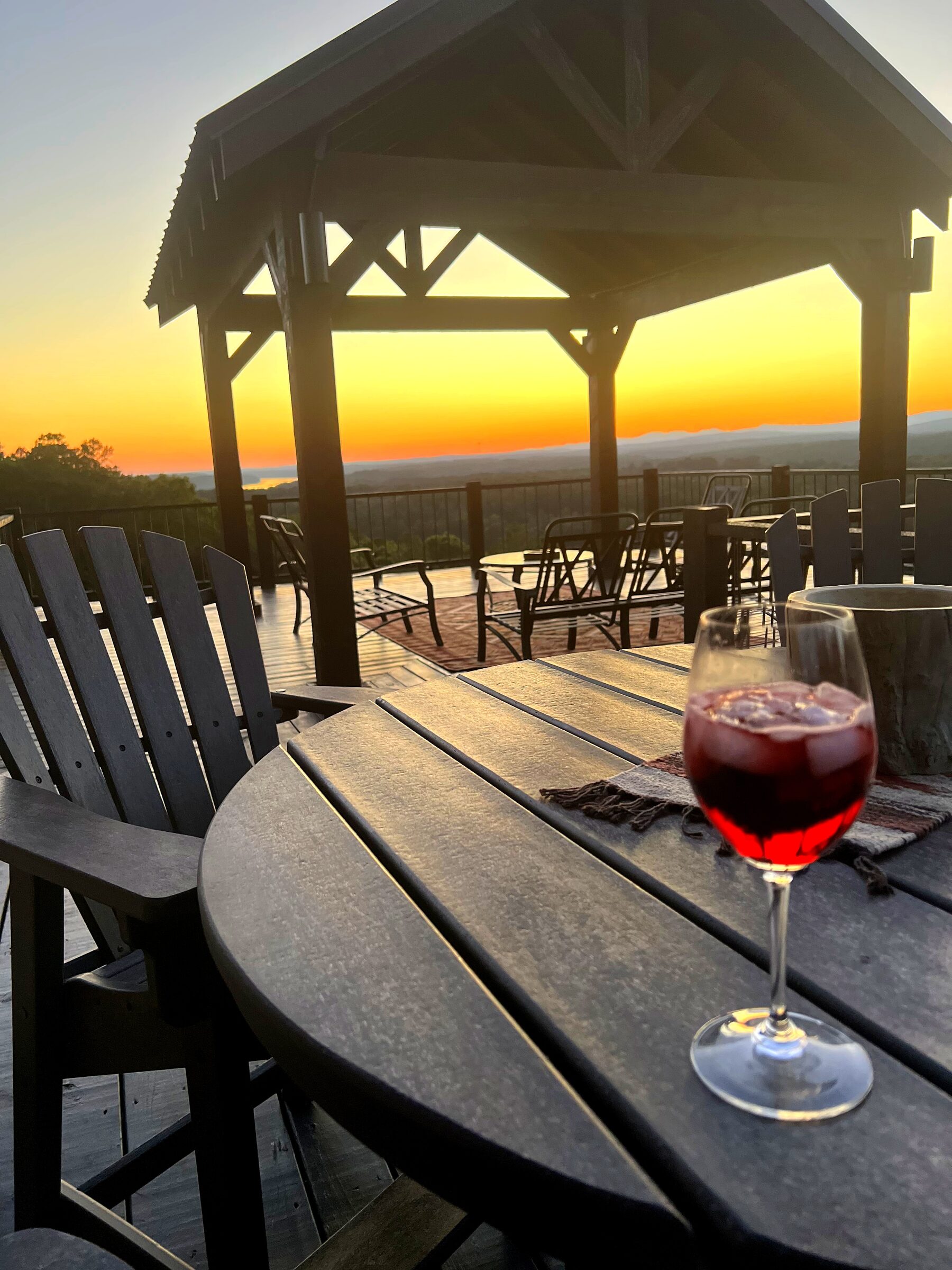 Sunset over the covered pavilion and deck at Mack Mountain Lodge, overlooking the Ouachita Mountains